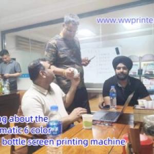 Customer visited us and talked about the Automatic 6 color Glass Bottle Screen Printing Machine